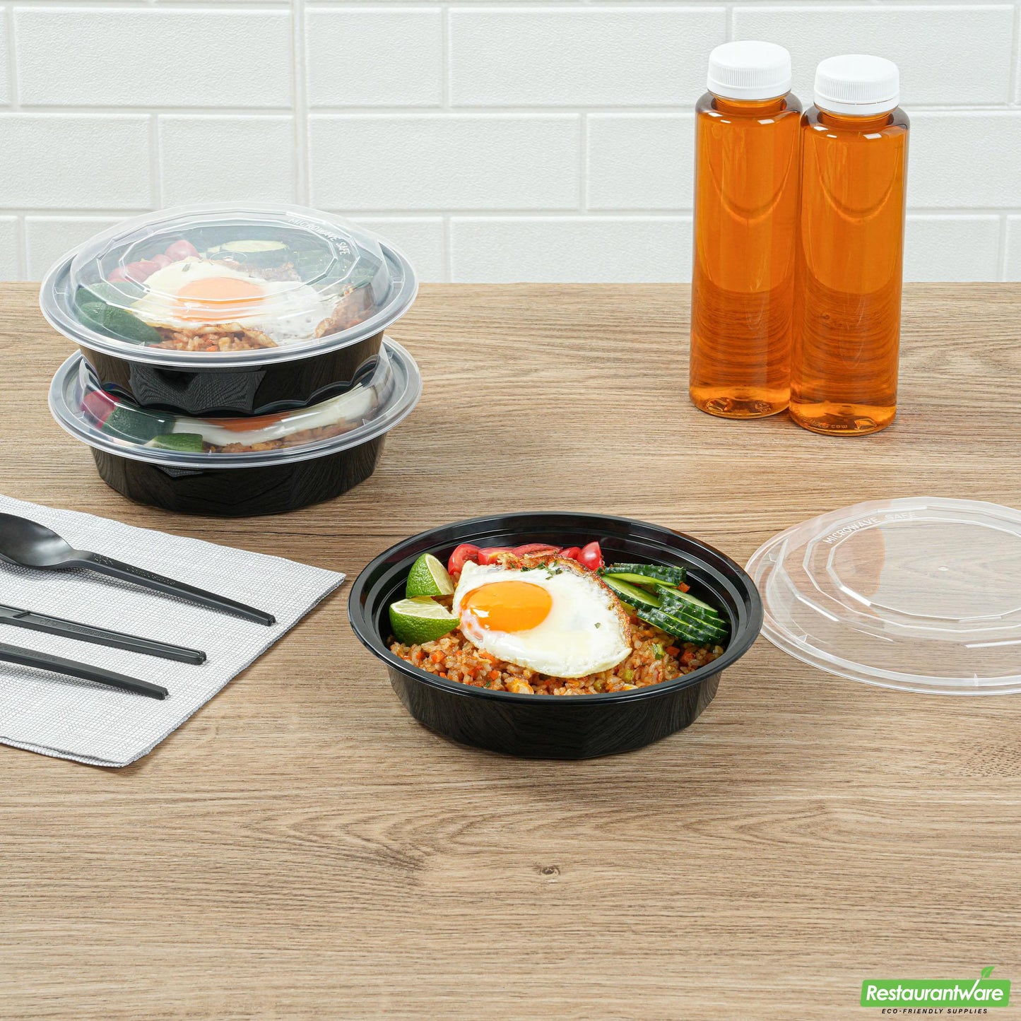 Wholesale Restaurantware 24 Oz Round Black Plastic to Go Box - with Clear Lid, Microwavable - 7.2" X 7.2" X 1.6"- Bulk