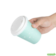 Wholesale Restaurantware Restpresso 12 Oz Blue Christmas Snowflakes Paper Single Wall Coffee Cup - with White Lid - 3 1/2" X 3 1/2" X 4 3/4" - 20 Count Box- Bulk