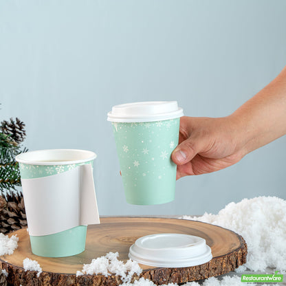 Wholesale Restaurantware Restpresso 12 Oz Blue Christmas Snowflakes Paper Single Wall Coffee Cup - with White Lid - 3 1/2" X 3 1/2" X 4 3/4" - 20 Count Box- Bulk