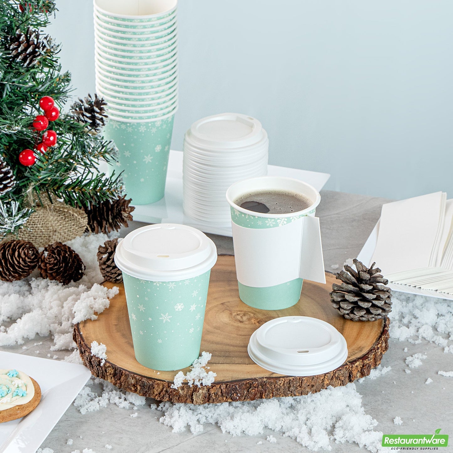 Wholesale Restaurantware Restpresso 12 Oz Blue Christmas Snowflakes Paper Single Wall Coffee Cup - with White Lid - 3 1/2" X 3 1/2" X 4 3/4" - 20 Count Box- Bulk