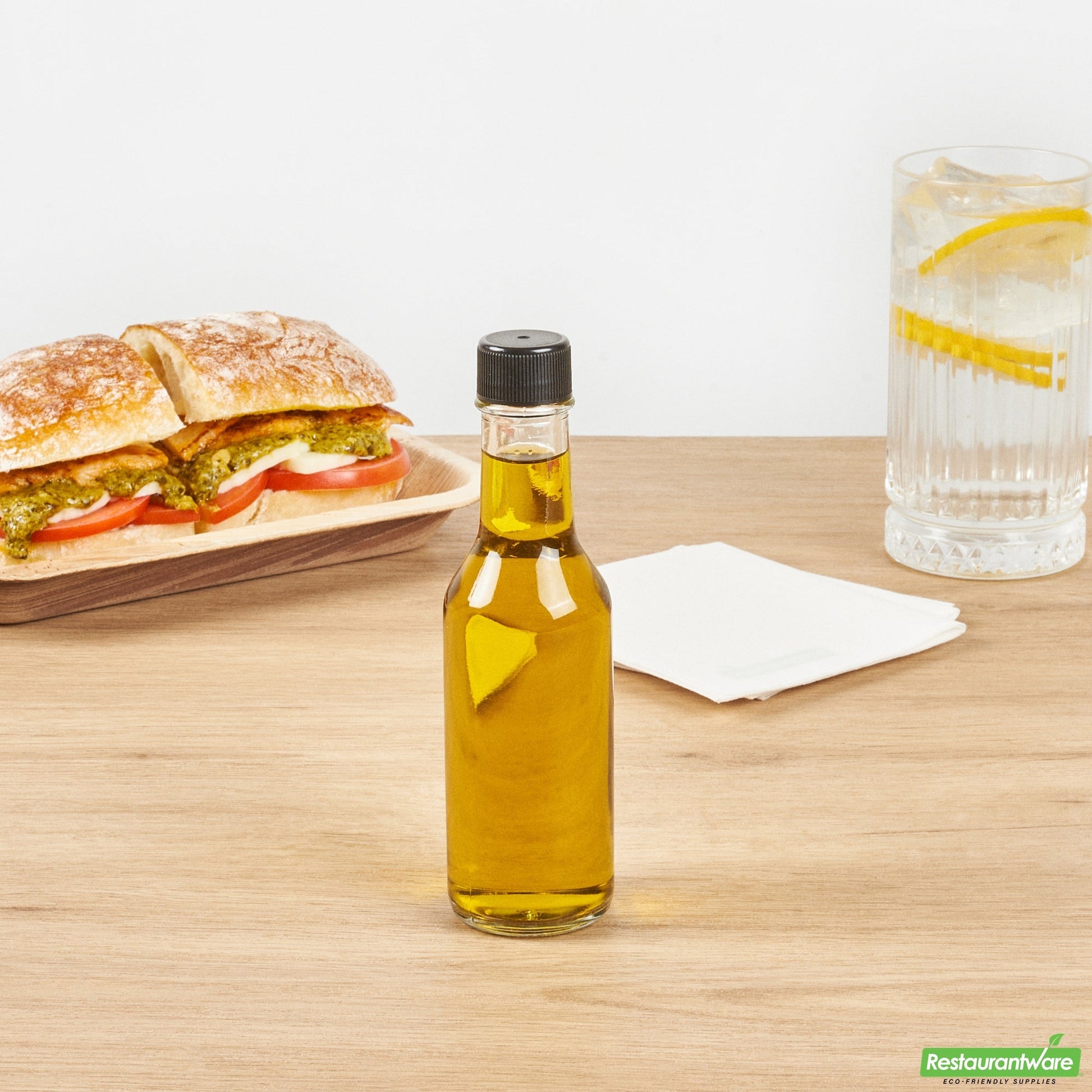 Wholesale Restaurantware Vetri 5 Oz Glass Woozy Bottle - with Black Cap - 1 3/4" X 1 3/4" X 6 3/4" - 10 Count Box- Bulk