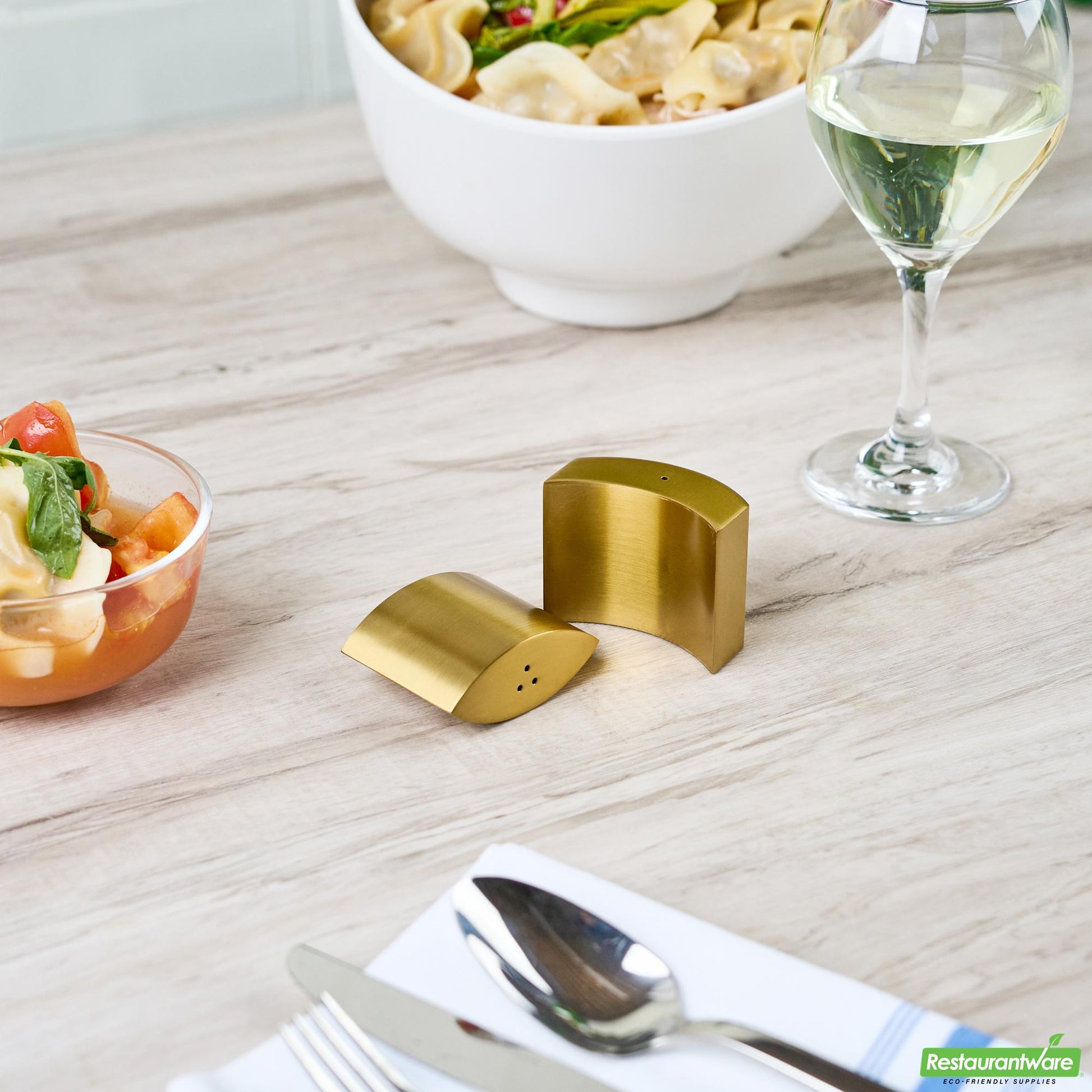 Wholesale Restaurantware 4 Oz Gold Stainless Steel Embracing Salt and Pepper Shaker Set - 2.3 oz/2.1 Oz - 2 1/2" X 2" X 1 3/4" - 1 Count Box- Bulk