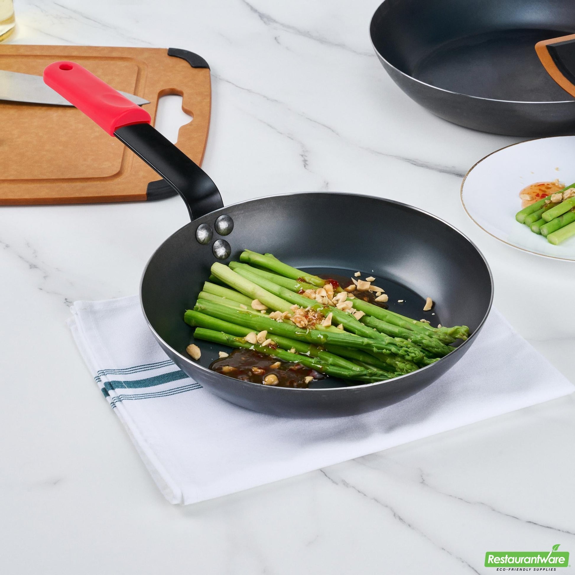 Wholesale Restaurantware Bundle: 1 Black Carbon Steel 9 1/2" Pre-Seasoned Fry Pan and 1 Sleeve- Bulk