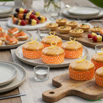 Restaurantware Panificio 4 Oz Round Polka-Dotted Hot Orange Paper Baking Cup - Ridged - 3 1/2" X 3 1/2" X 1"