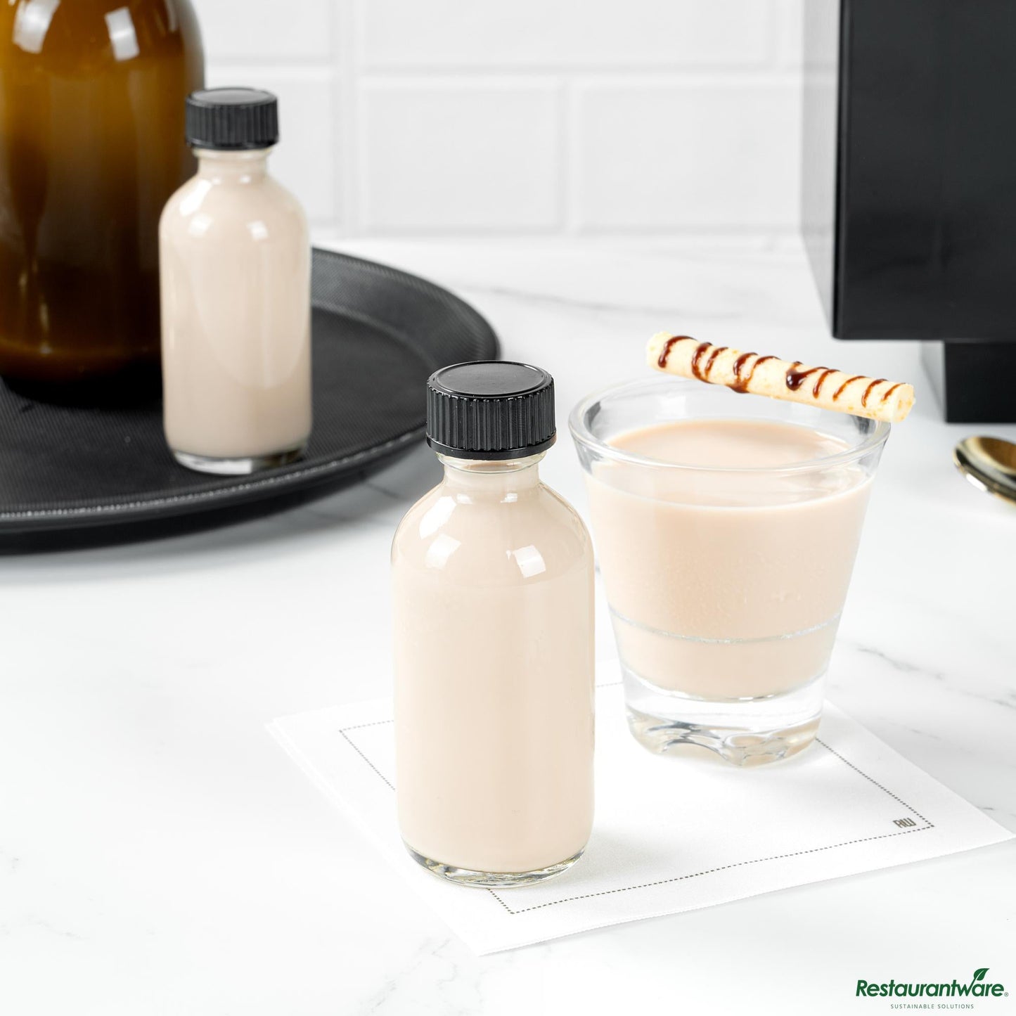 Wholesale Restaurantware 2 Oz Boston Round Clear Glass Bottle - with Black Phenolic Cap - 1.5" X 1.5" X 3.7"- Bulk