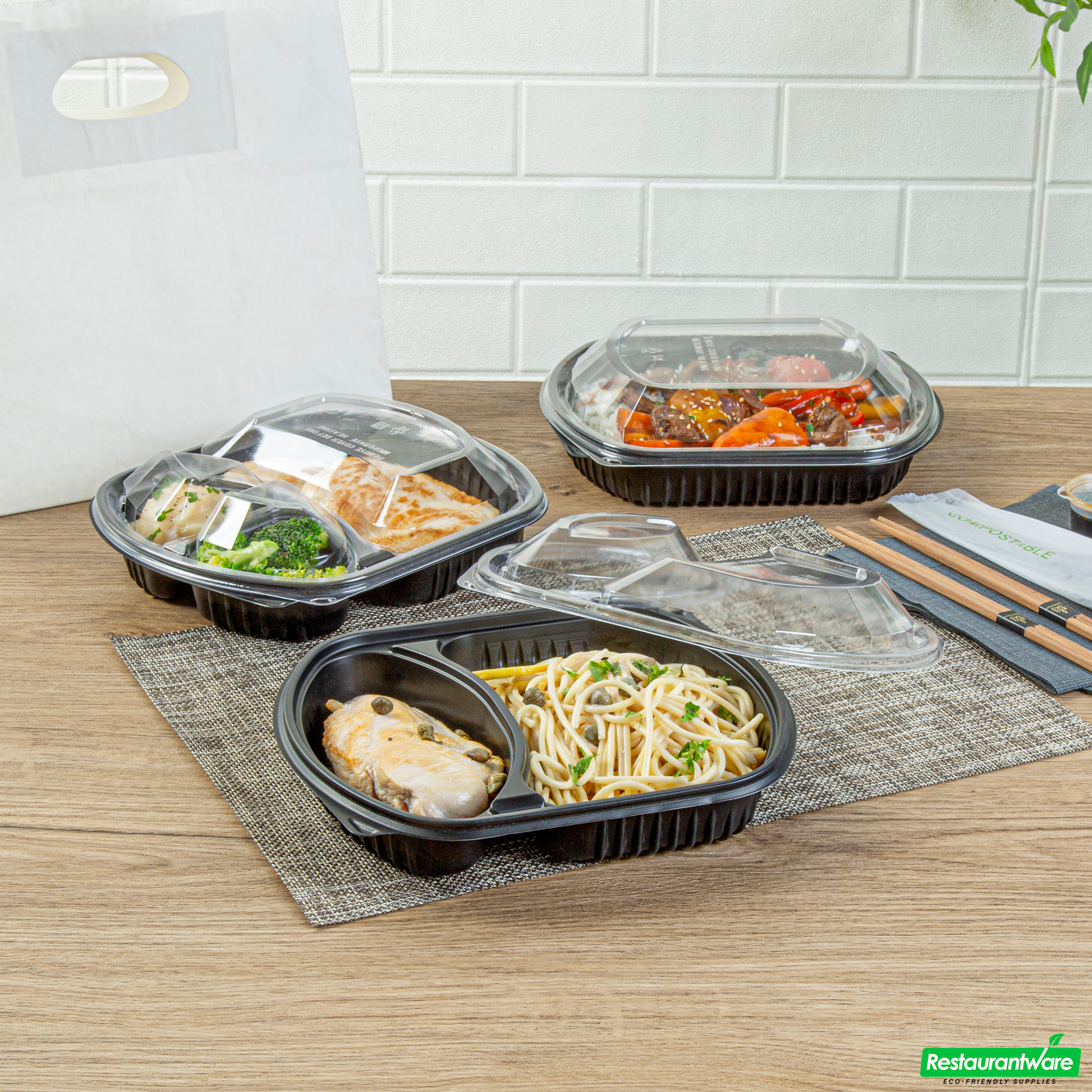 Wholesale Restaurantware 36 Oz Rectangle Black Plastic Food Container - with Clear Lid, Microwavable, 2 Compartments - 9 1/4" X 8" X 2 3/4" - 50 Count Box- Bulk
