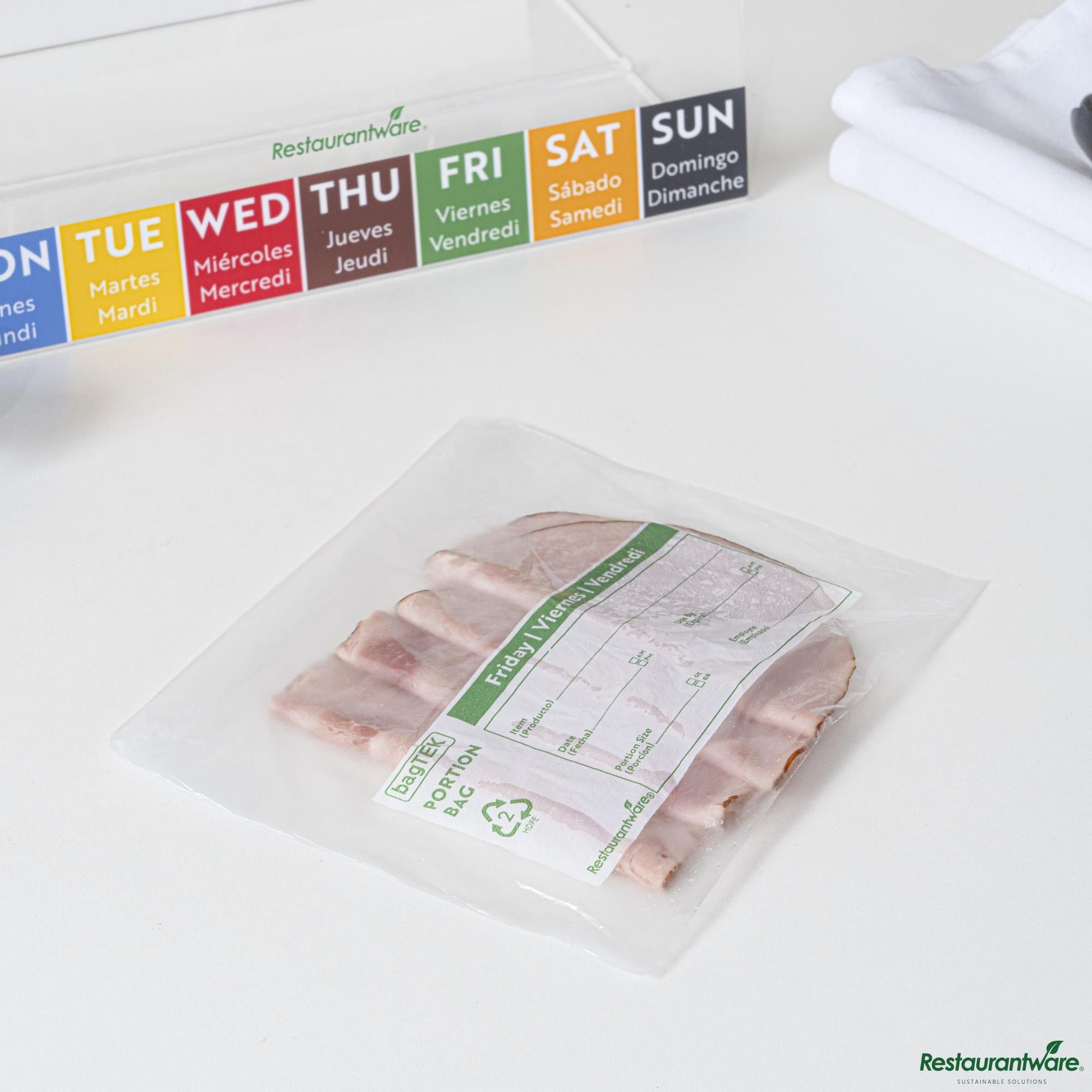 Wholesale Restaurantware Clear and Green Plastic Day of the Week Friday Portion Bag - 6.5"×7"×0.001"- Bulk