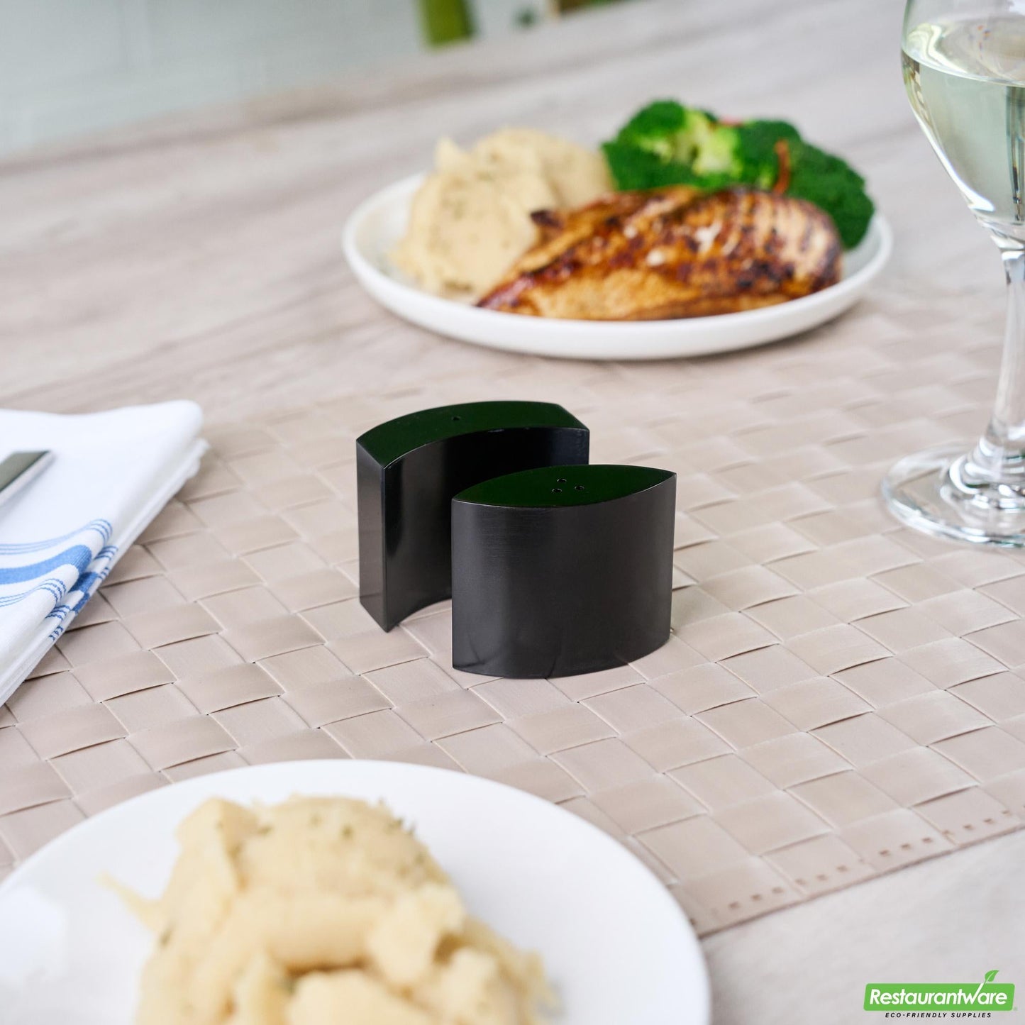 Wholesale Restaurantware 4 Oz Black Stainless Steel Embracing Salt and Pepper Shaker Set - 2.3 oz/2.1 Oz - 2 1/2" X 2" X 1 3/4" - 1 Count Box- Bulk