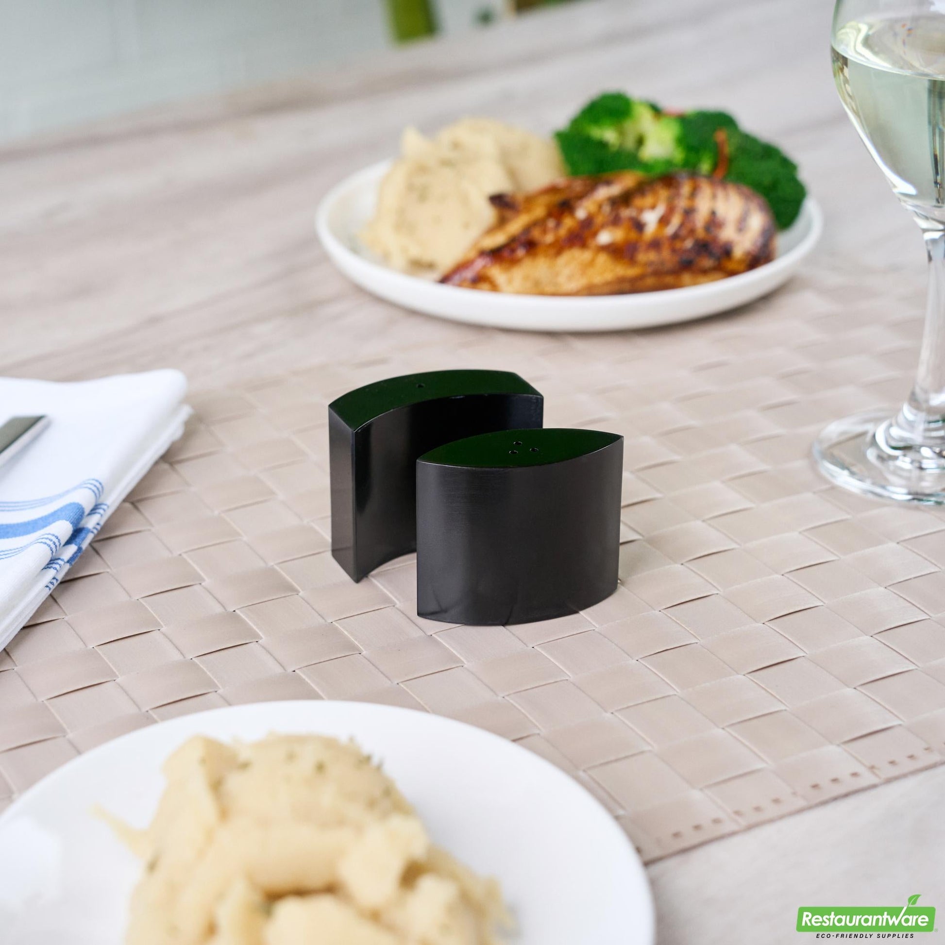 Wholesale Restaurantware 4 Oz Black Stainless Steel Embracing Salt and Pepper Shaker Set - 2.3 oz/2.1 Oz - 2 1/2" X 2" X 1 3/4" - 1 Count Box- Bulk