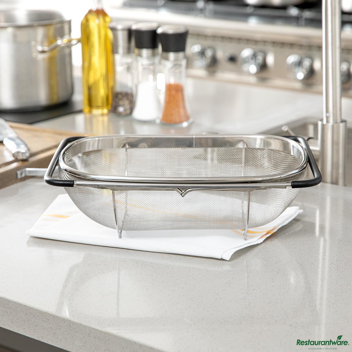 Wholesale Restaurantware 6 Qt Stainless Steel over-the-Sink Colander - Expandable Handles - 14.2" X 9.6" X 4.3"- Bulk