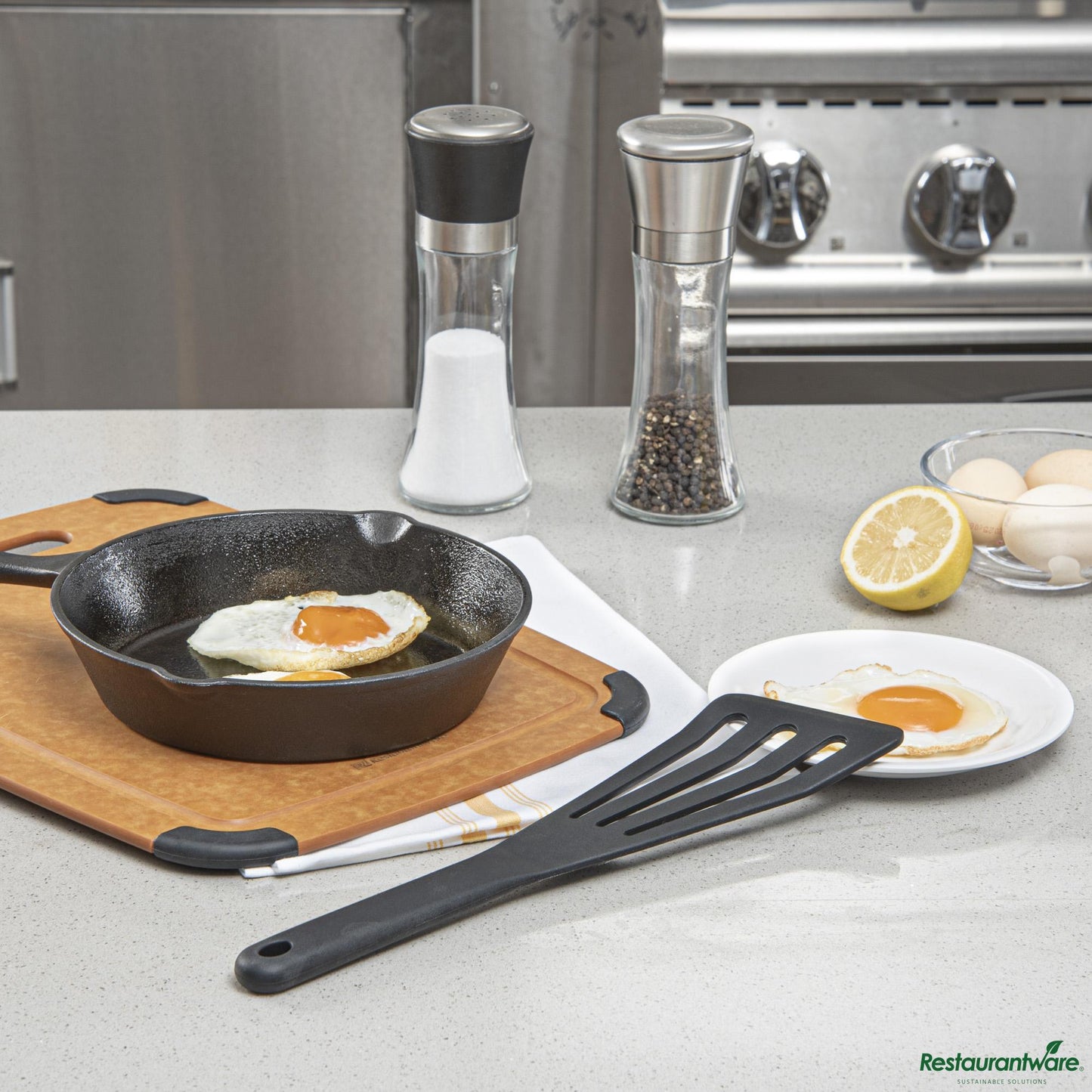 Wholesale Restaurantware Black Silicone High Temperature Slotted Turner / Spatula - 12.3" X 3.5" X 0.5"- Bulk