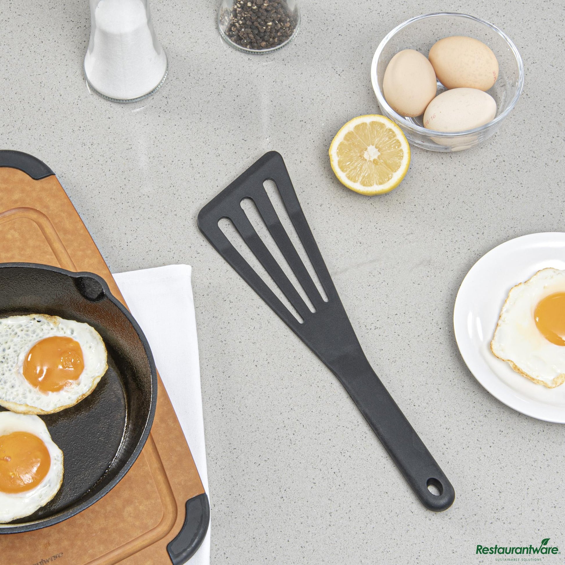 Wholesale Restaurantware Black Silicone High Temperature Slotted Turner / Spatula - 12.3" X 3.5" X 0.5"- Bulk